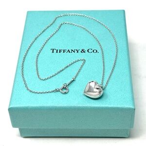 Authentic Tiffany & Co. Elsa Peretti Curved Heart Pendant Necklace.